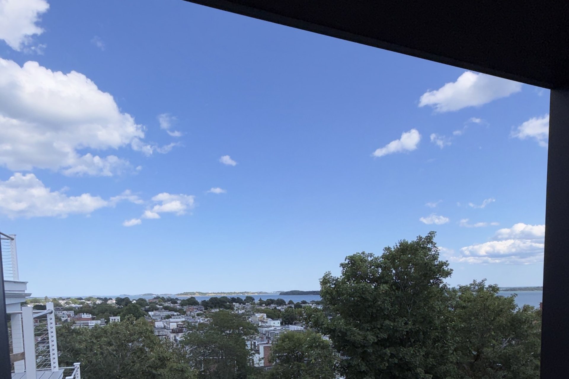 Photograph from a private deck at 421 East Sixth, looking across South Boston toward the harbor